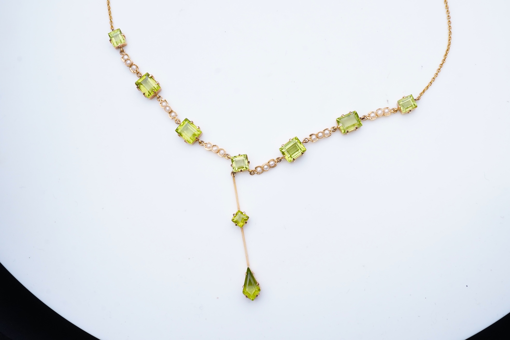 An Edwardian peridot and seed pearl necklace, early 20th century